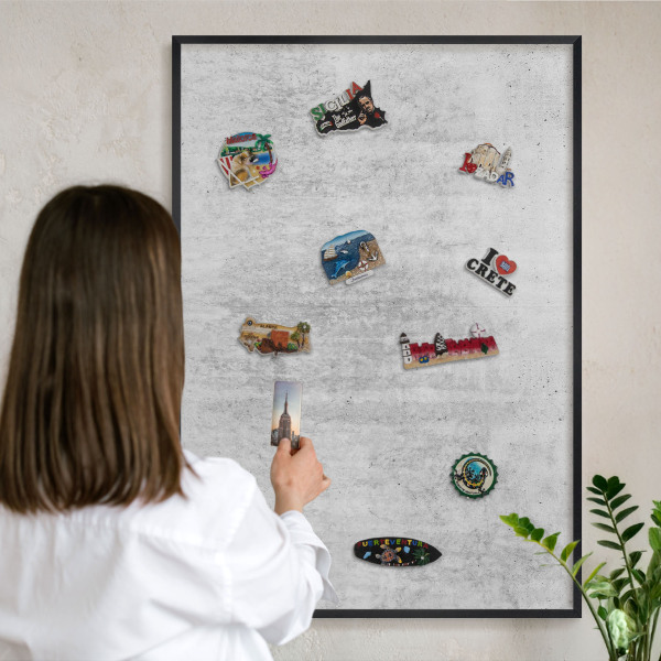 Metal wall board for magnets in a black frame Gray texture