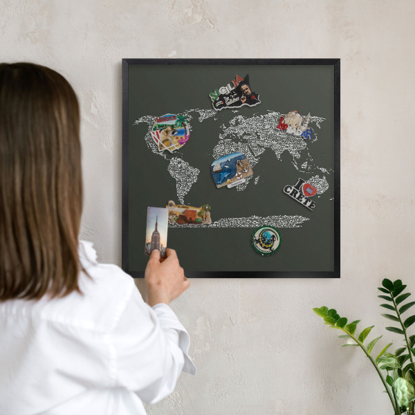 Metal wall board for magnets in a black frame Text map