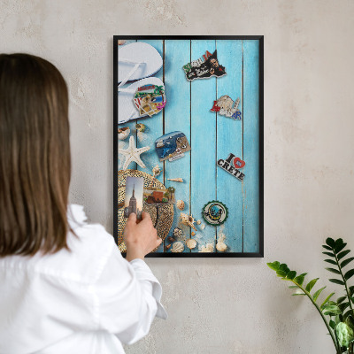 Metal wall board for magnets in a black frame Holiday atmosphere