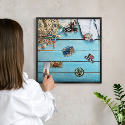 Metal wall board for magnets in a black frame Holiday atmosphere