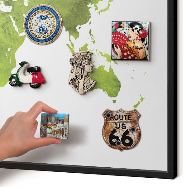 Vacation magnet board with a black frame Green map