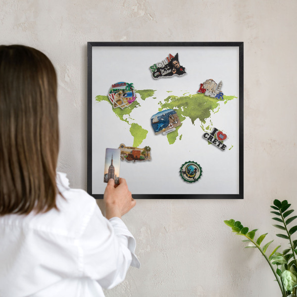 Vacation magnet board with a black frame Green map