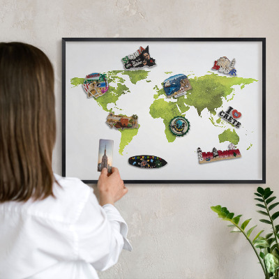 Vacation magnet board with a black frame Green map