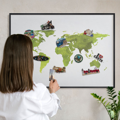 Vacation magnet board with a black frame Green map