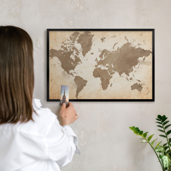 Metal wall board for magnets in a black frame World map