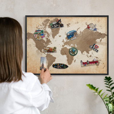 Metal wall board for magnets in a black frame World map