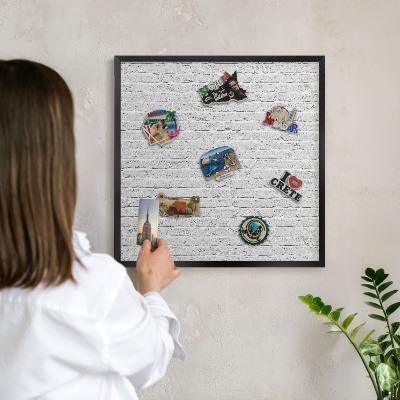 Vacation magnet board with a black frame Brick wall