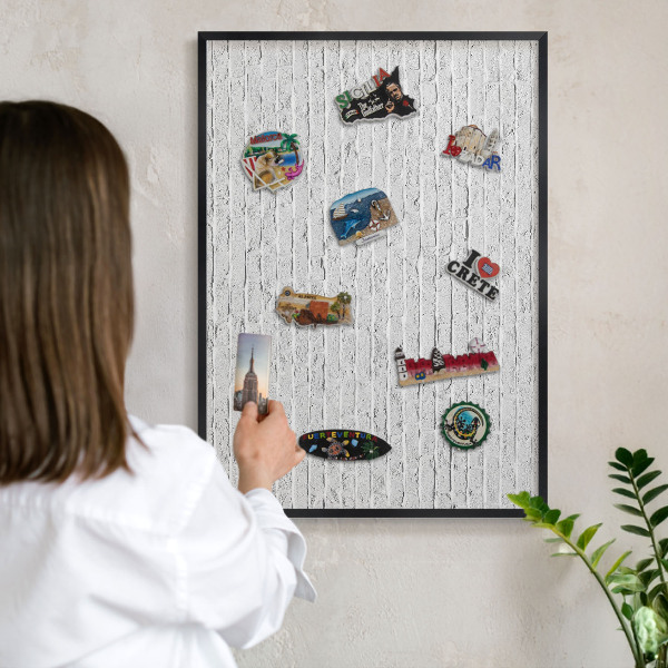 Vacation magnet board with a black frame Brick wall