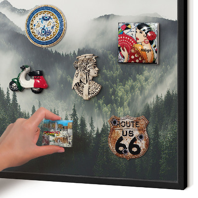 Vacation magnet board with a black frame Green mountains