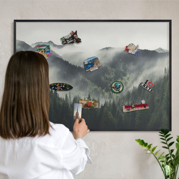 Vacation magnet board with a black frame Green mountains