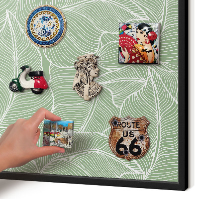 Metal wall board for magnets in a black frame Tropical leaves