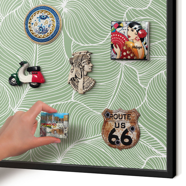 Metal wall board for magnets in a black frame Tropical leaves