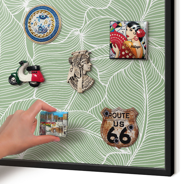 Metal wall board for magnets in a black frame Tropical leaves