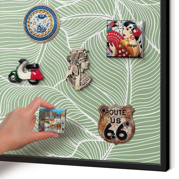 Metal wall board for magnets in a black frame Tropical leaves