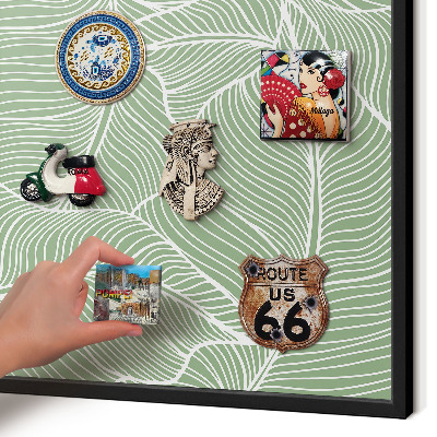 Metal wall board for magnets in a black frame Tropical leaves