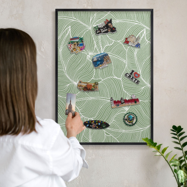 Metal wall board for magnets in a black frame Tropical leaves