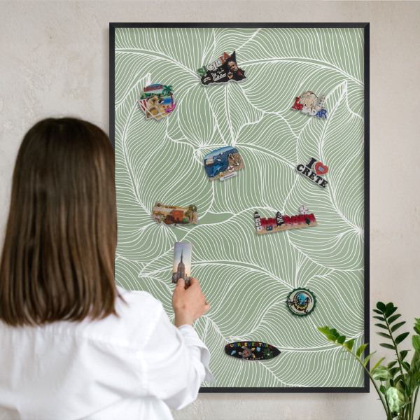 Metal wall board for magnets in a black frame Tropical leaves