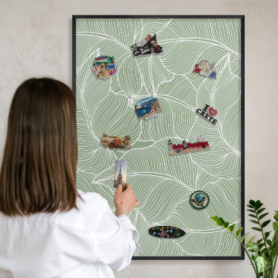 Metal wall board for magnets in a black frame Tropical leaves