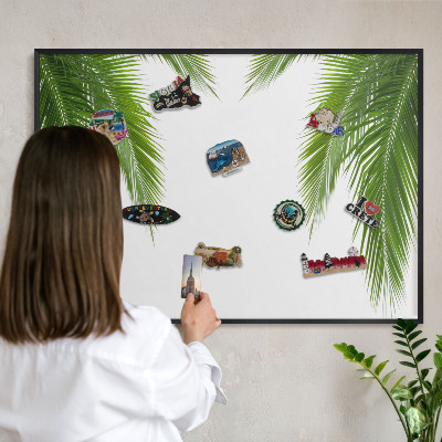 Metal wall board for magnets in a black frame Exotic nature