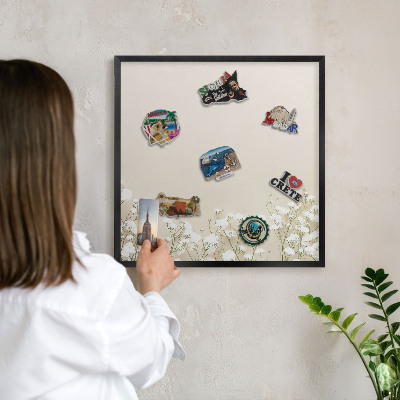 Vacation magnet board with a black frame Subtle nature