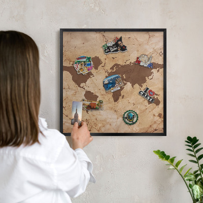 Metal wall board for magnets in a black frame World map