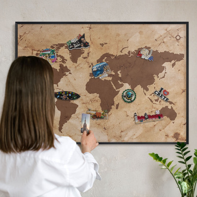 Metal wall board for magnets in a black frame World map