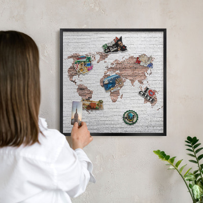 Vacation magnet board with a black frame Brick map
