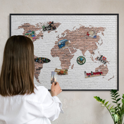 Vacation magnet board with a black frame Brick map
