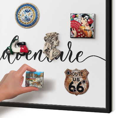 Vacation magnet board with a black frame Adventure written