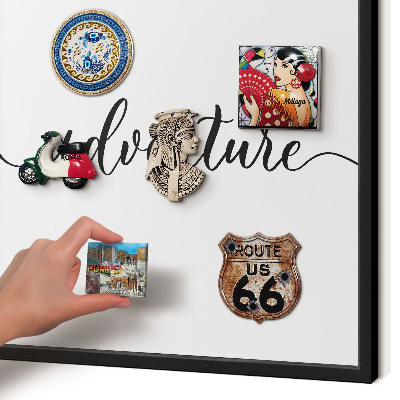 Vacation magnet board with a black frame Adventure written
