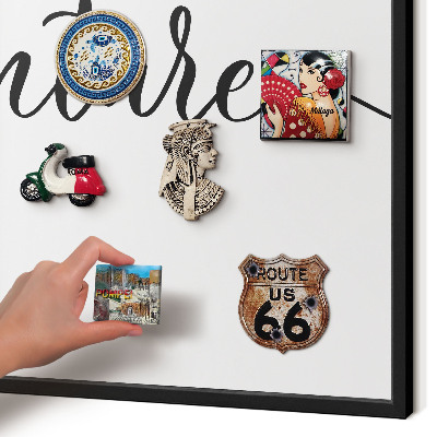 Vacation magnet board with a black frame Adventure written