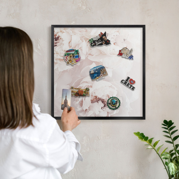 Vacation magnet board with a black frame White peonies