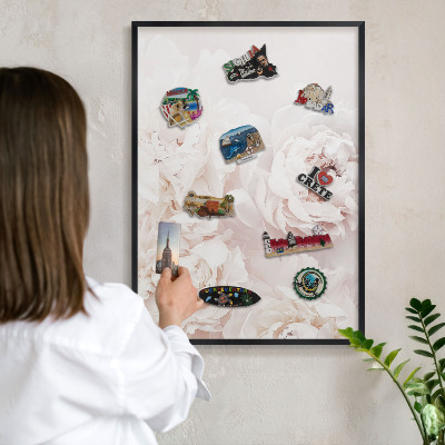 Vacation magnet board with a black frame White peonies