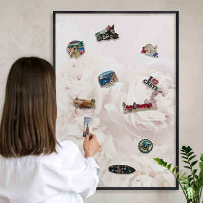 Vacation magnet board with a black frame White peonies
