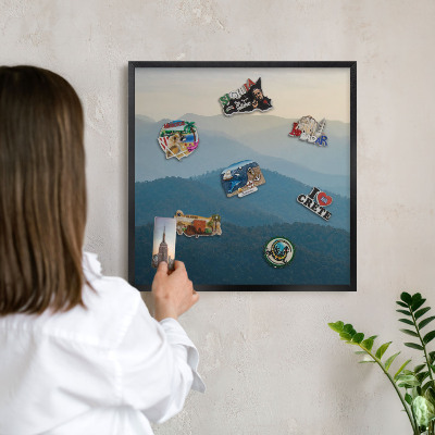 Metal wall board for magnets in a black frame Mountain views