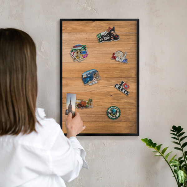 Metal wall board for magnets in a black frame Wooden texture