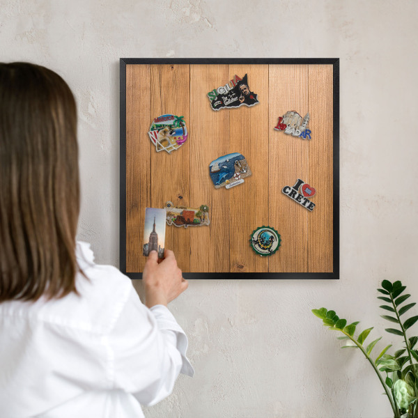 Metal wall board for magnets in a black frame Wooden texture
