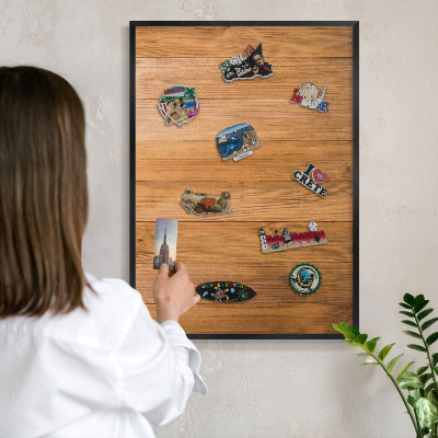 Metal wall board for magnets in a black frame Wooden texture