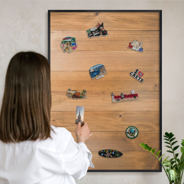 Metal wall board for magnets in a black frame Wooden texture