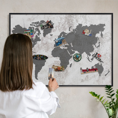 Metal wall board for magnets in a black frame World map