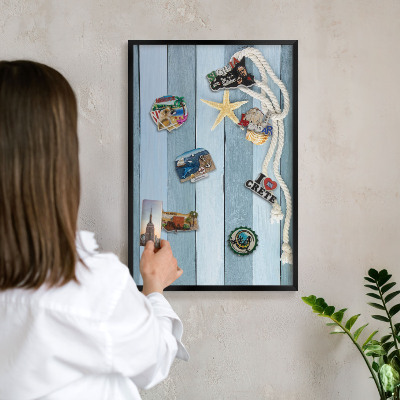 Vacation magnet board with a black frame Maritime climate