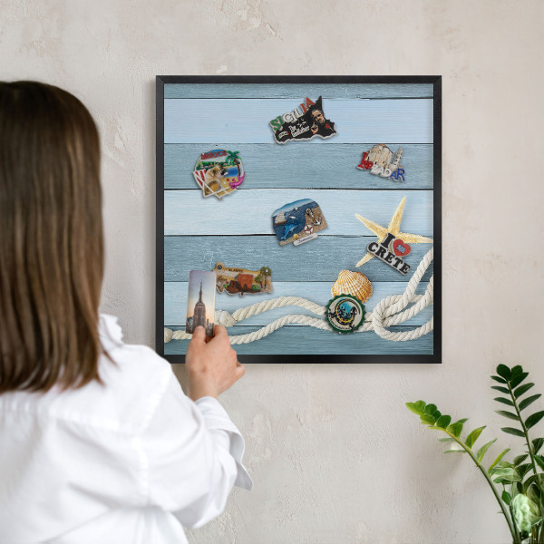 Vacation magnet board with a black frame Maritime climate
