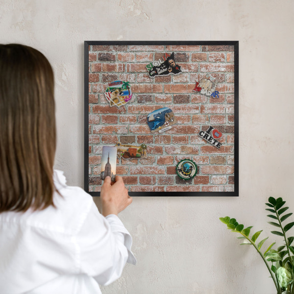Vacation magnet board with a black frame Brick wall