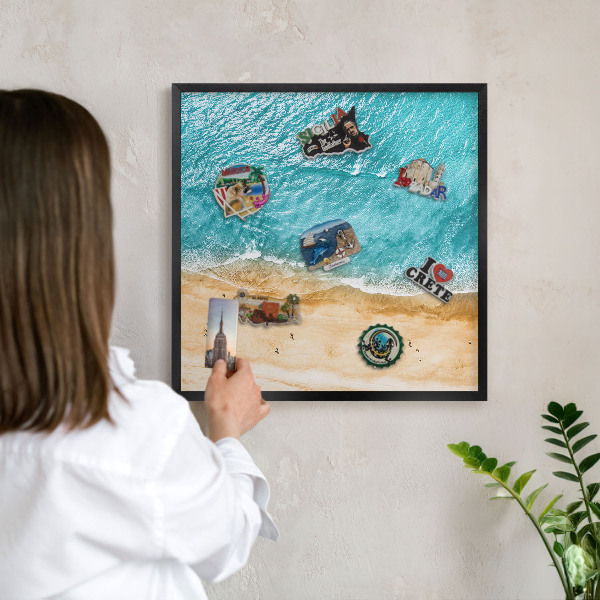Metal wall board for magnets in a black frame Sea and beach