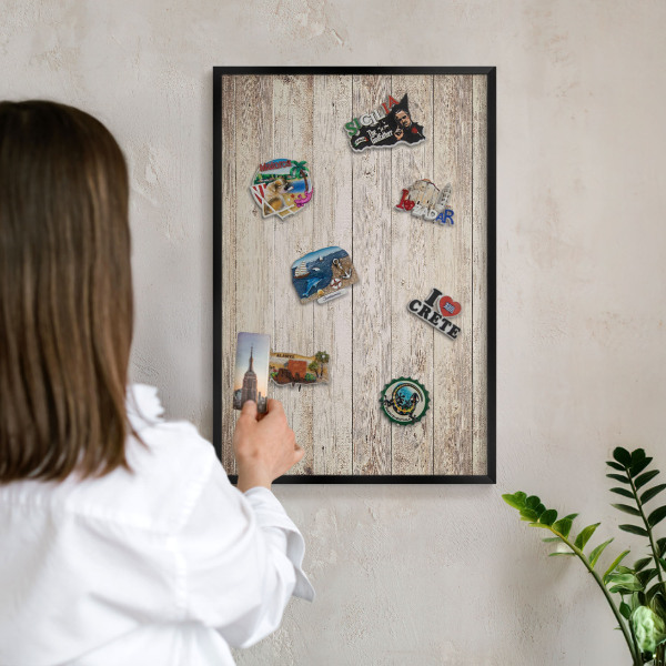 Metal wall board for magnets in a black frame Wooden texture