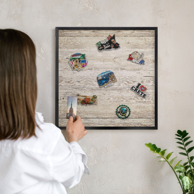 Metal wall board for magnets in a black frame Wooden texture