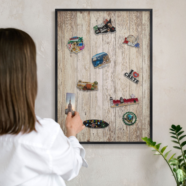 Metal wall board for magnets in a black frame Wooden texture