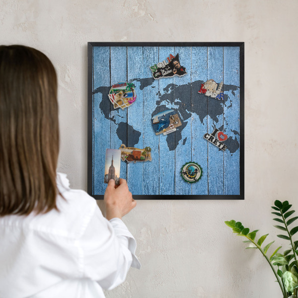 Metal wall board for magnets in a black frame World map