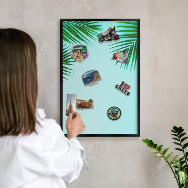 Vacation magnet board with a black frame Green leaves