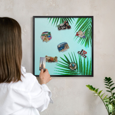 Vacation magnet board with a black frame Green leaves